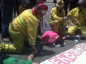 Paramedics handle protester in Santa Ana