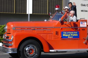 Miguel Pulido waves from a fire truck