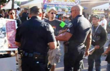 SAPD talk to protesters at the Fiestas Patrias