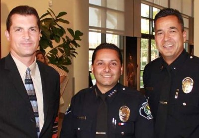 Santa Ana Police Chief Carlos Rojas (pictured in the middle)