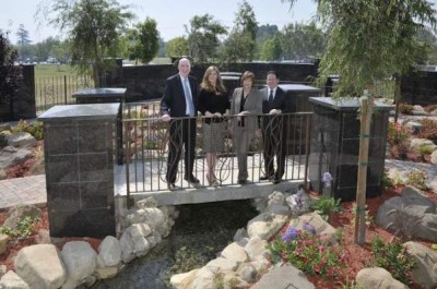 Pictured are Leo O’Connor, Vice President and Chief Financial Officer; Tiffany Gallarzo, Vice President; Marla Noel, President and Board Member; and Omar Gallarzo, Vice President of Operations on a bridge in Eternal Springs