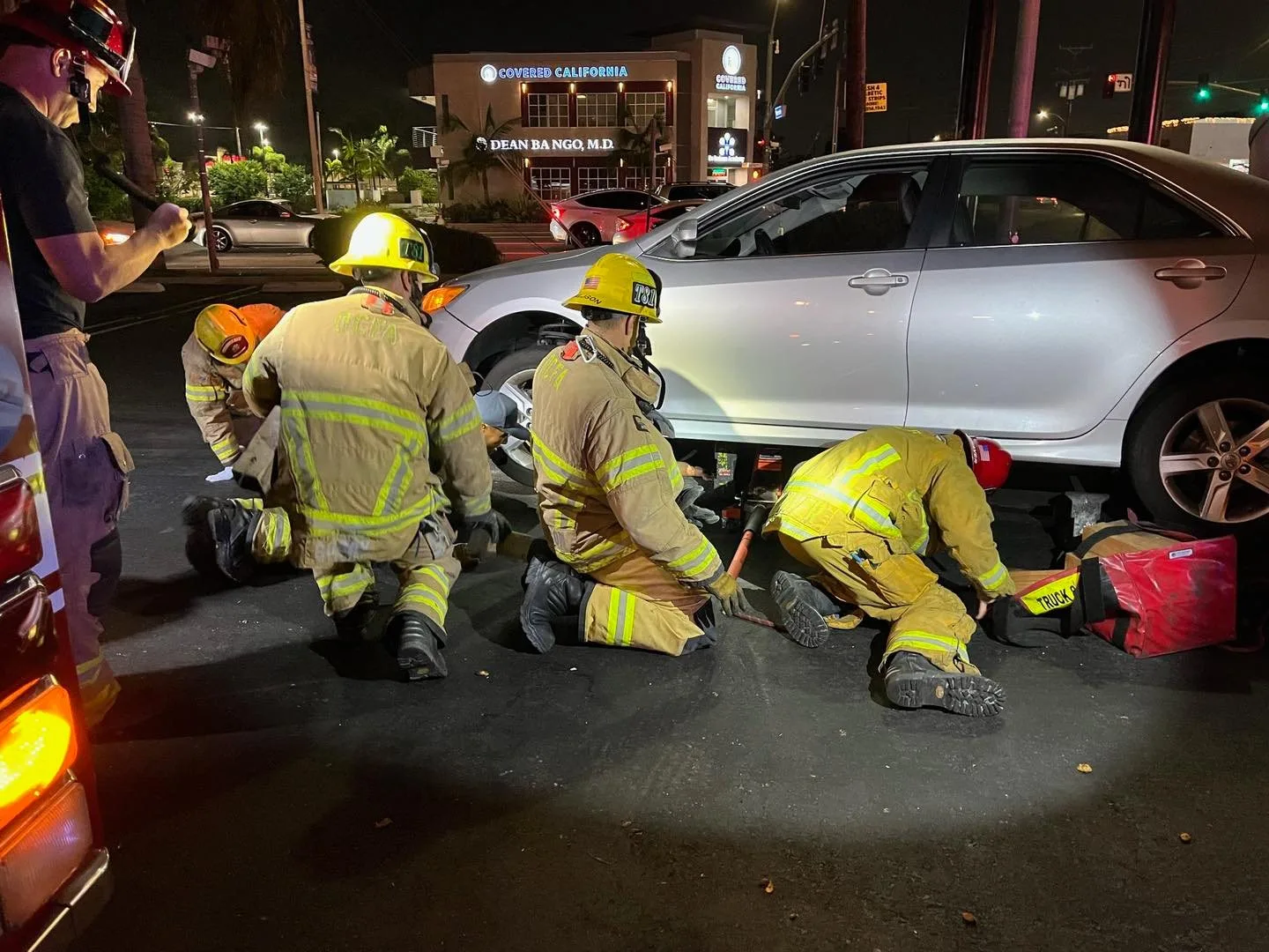 Firefighters lifted a car off a woman who was run over in Garden Grove