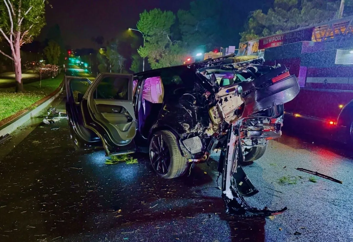 An SUV was completely wrecked after hitting two light poles and a tree in Newport Beach