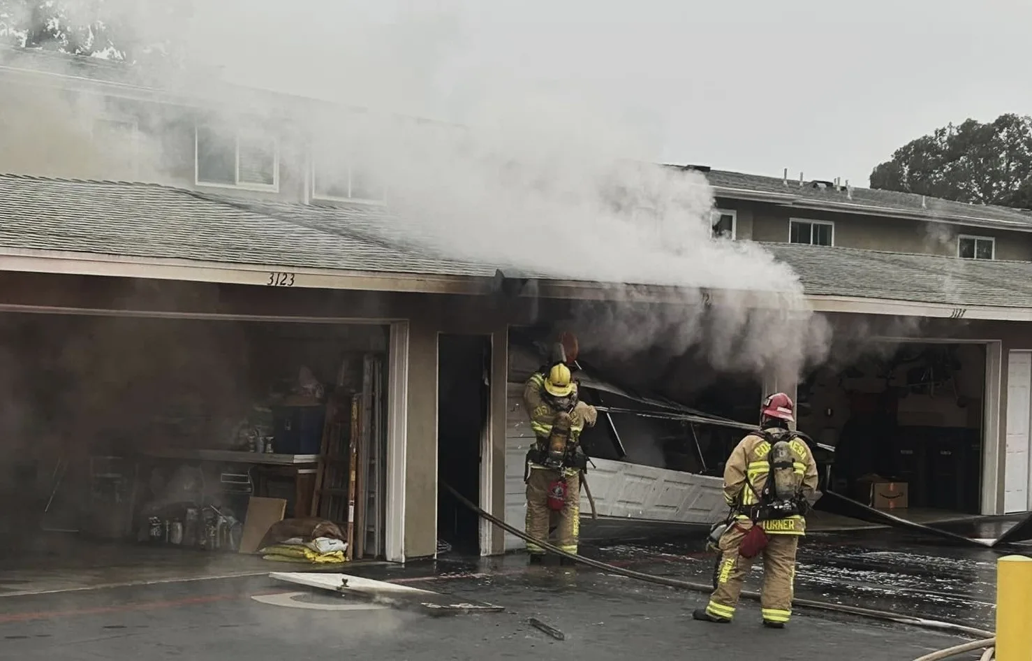 Firefighters put out a carport fire at a Costa Mesa apartment complex