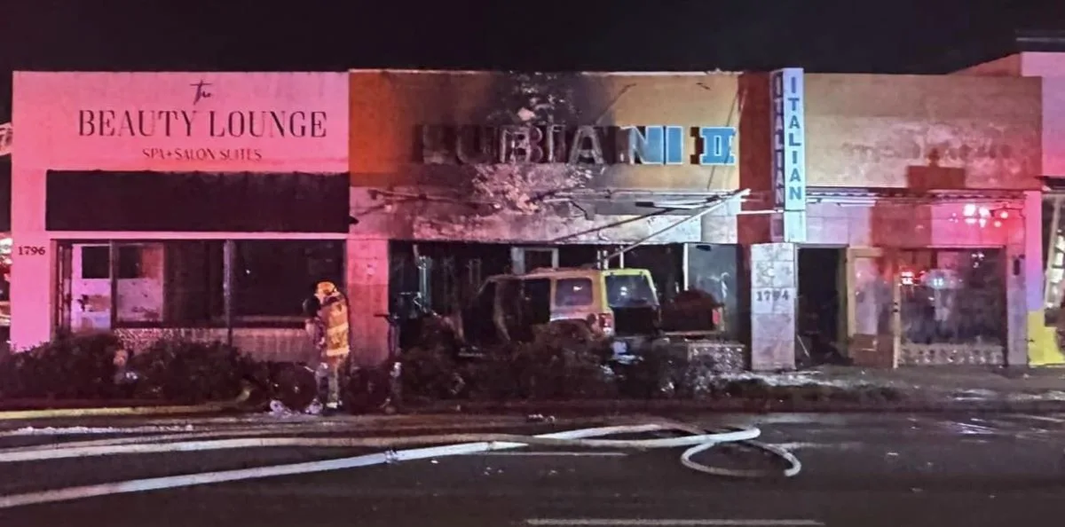 A vehicle started a fire after crashing into a mens clothing store in Costa Mesa