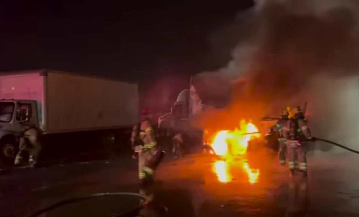 Fire caused by a two truck collision in Santa Ana put out by OCFA firefighters