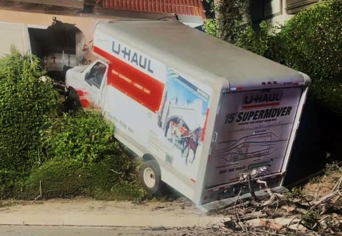 A driver crashed a U-Haul moving truck into a townhouse in Orange this morning then fled