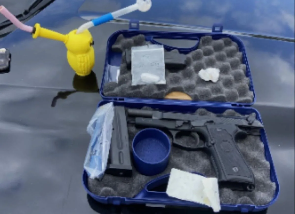 Man arrested after Irvine police find a stolen gun and drugs in his car